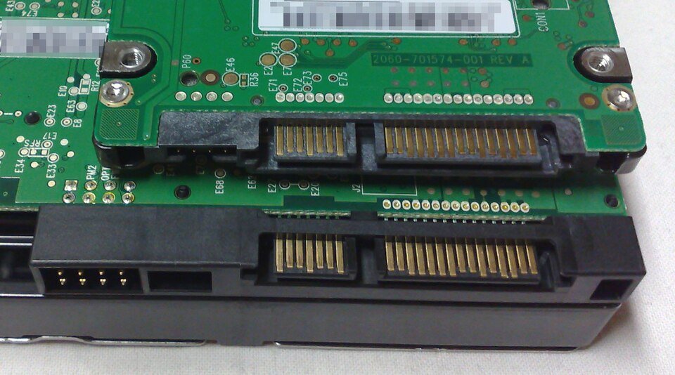 A 2.5-inch drive stacked on a 3.5-inch drive's connectors