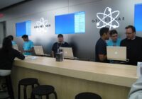 Apple Genius Bar counter with staff helping several customers