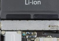 Apple's Taptic Engine bar mounted inside a disassembled iPhone