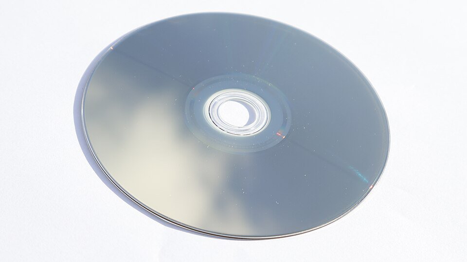 Backside of a Blu-ray disc reflecting light in bands