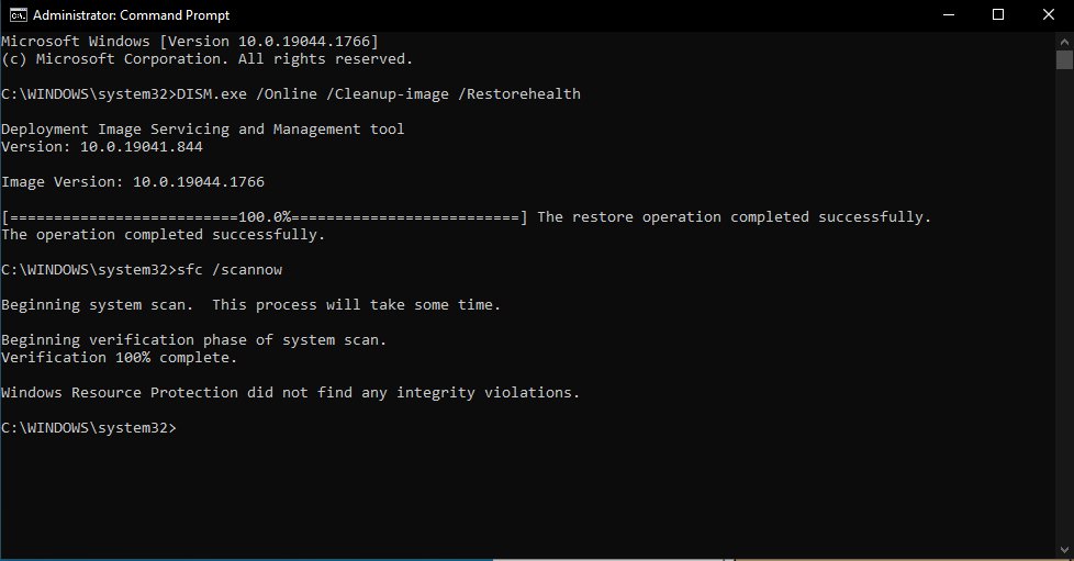 Command Prompt showing DISM RestoreHealth and sfc scannow completed successfully