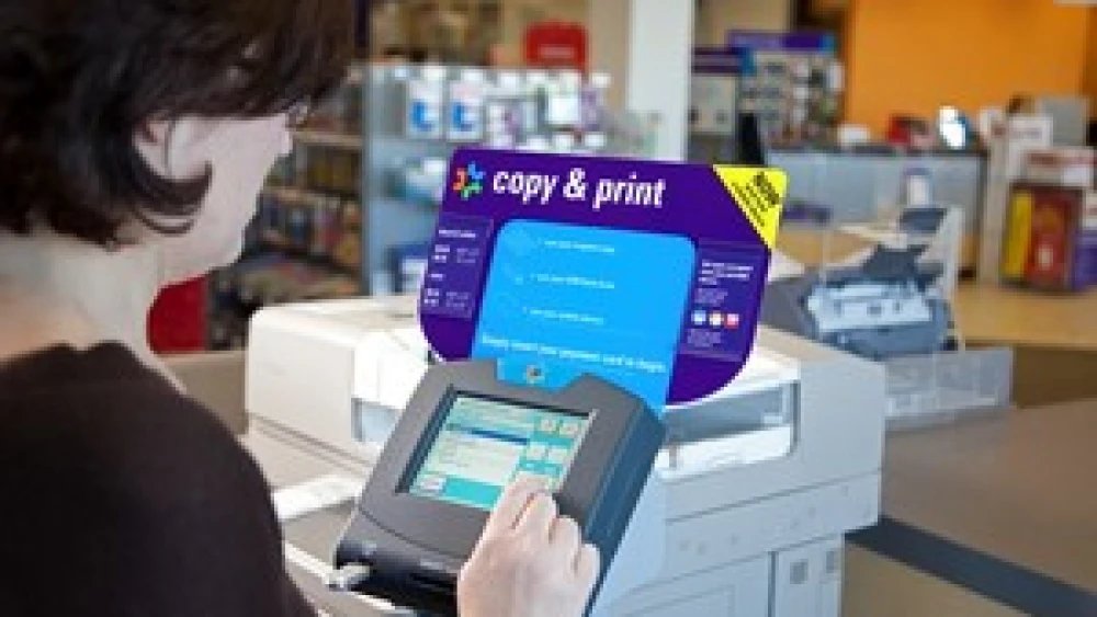 Customer entering input at a FedEx Office self-service copy and print station