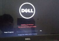 Dell laptop screen mid-flash with a progress bar during BIOS update