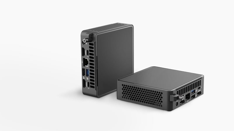 Two ASUS NUC kit units showing front and rear ports