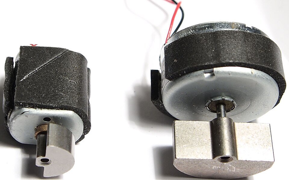 Two eccentric rotating mass vibration motors removed from a controller