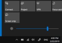 Windows 10 Action Center panel with the Brightness slider raised high