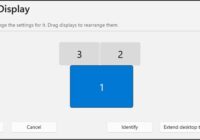 Windows 11 Display settings page with three numbered monitors ready to arrange