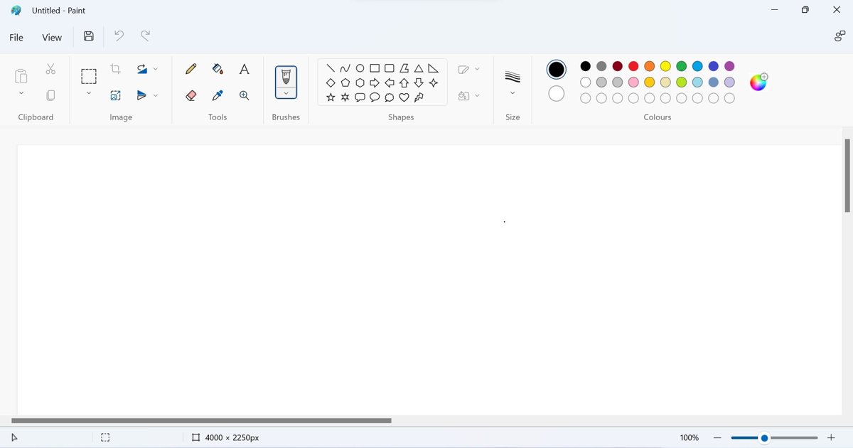Windows 11 Paint app open with ribbon toolbar and blank canvas
