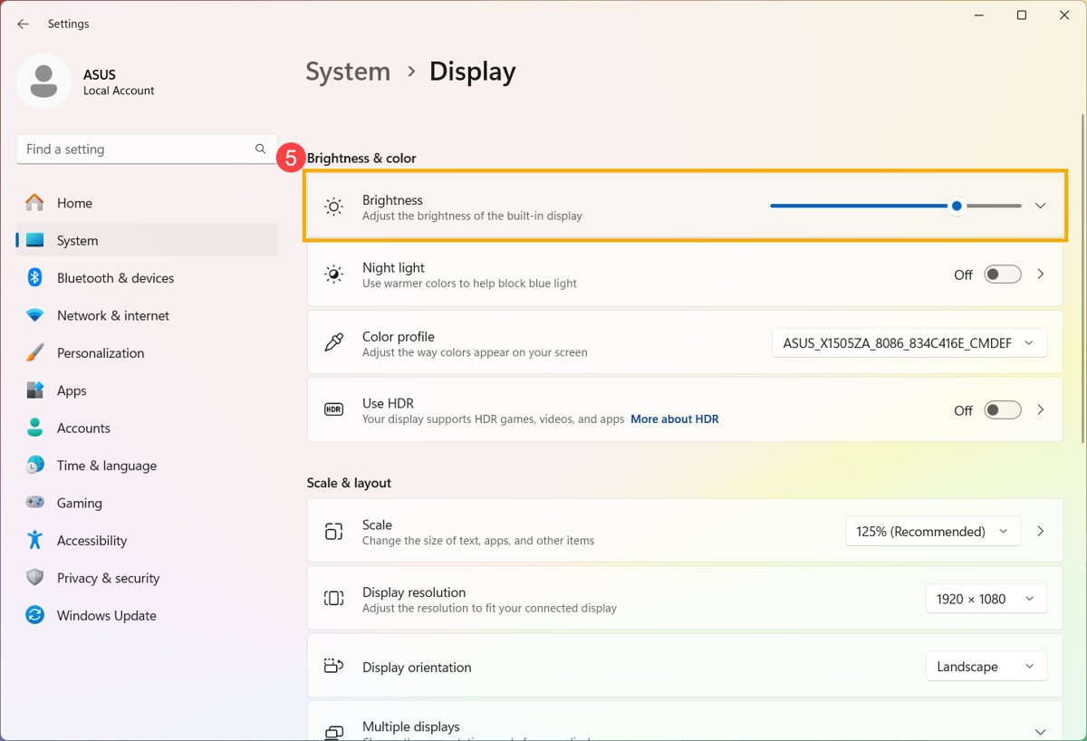 Windows 11 Settings Display page with the Brightness slider highlighted