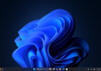 Windows 11 desktop and taskbar shown in dark color mode