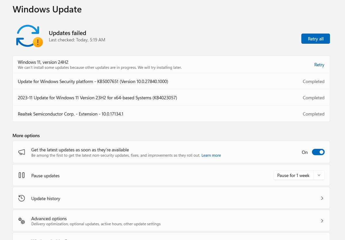Windows Update page showing Updates failed with a Retry button and update history