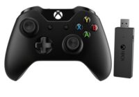 Xbox controller next to its USB Wireless Adapter for Windows