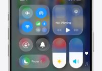 iPhone Control Center showing the Flashlight button glowing white