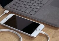 iPhone connected by USB-C cable to a Surface laptop