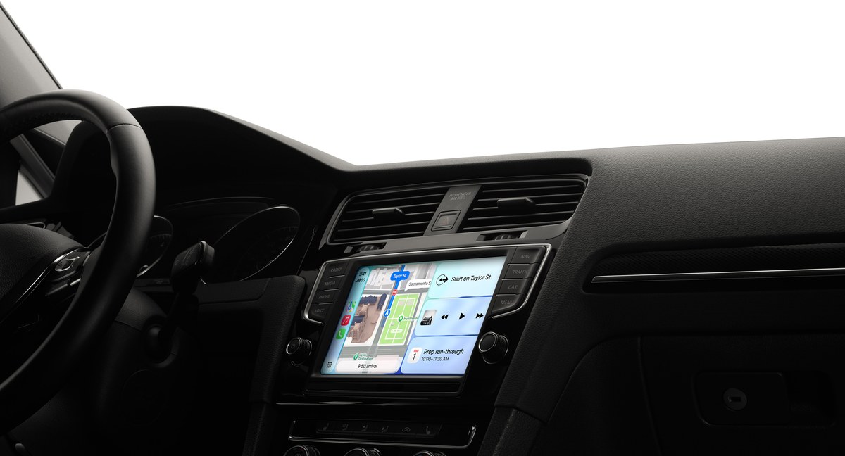 Apple CarPlay Dashboard on a car's dashboard touchscreen showing Maps and music