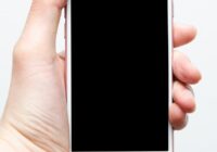 Retrieve lost text message draft on iPhone - hand holding a phone