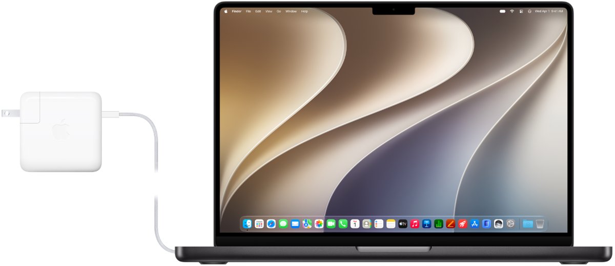 Charging port on a MacBook Pro with the power adapter attached