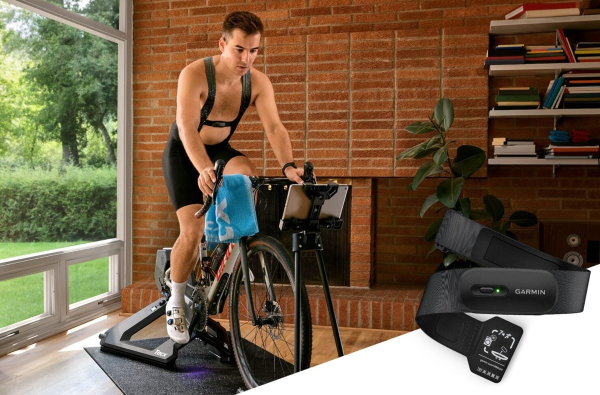 Cyclist on an indoor trainer wearing the Garmin HRM 200 chest strap