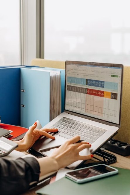 How to use Excel: spreadsheet open on a laptop at a desk