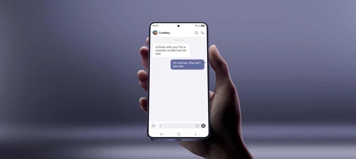 Galaxy S26 Ultra held up showing a private message thread