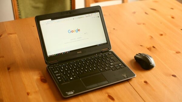 Google Chrome settings and Google search open in Chrome on a Windows laptop