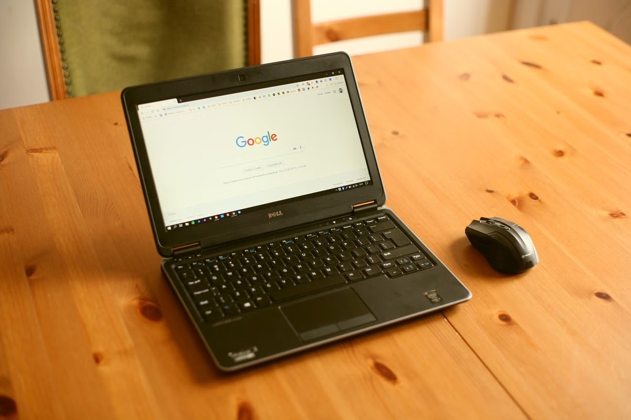 Google Chrome settings and Google search open in Chrome on a Windows laptop