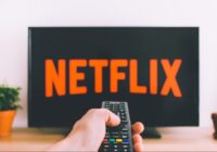 Cancel Netflix on all devices - TV remote in front of Netflix