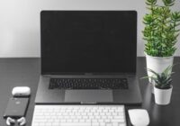 Delete multiple text messages on a Mac - laptop and phone on a desk