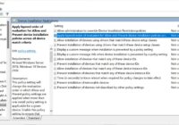 Local Group Policy Editor open at Device Installation Restrictions with its policy list