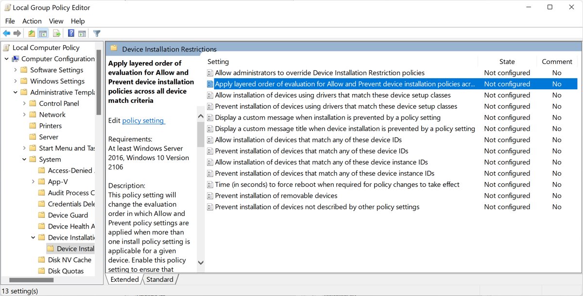 Local Group Policy Editor open at Device Installation Restrictions with its policy list