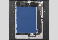 Opened iPad Air in a repair tray with the battery highlighted in blue