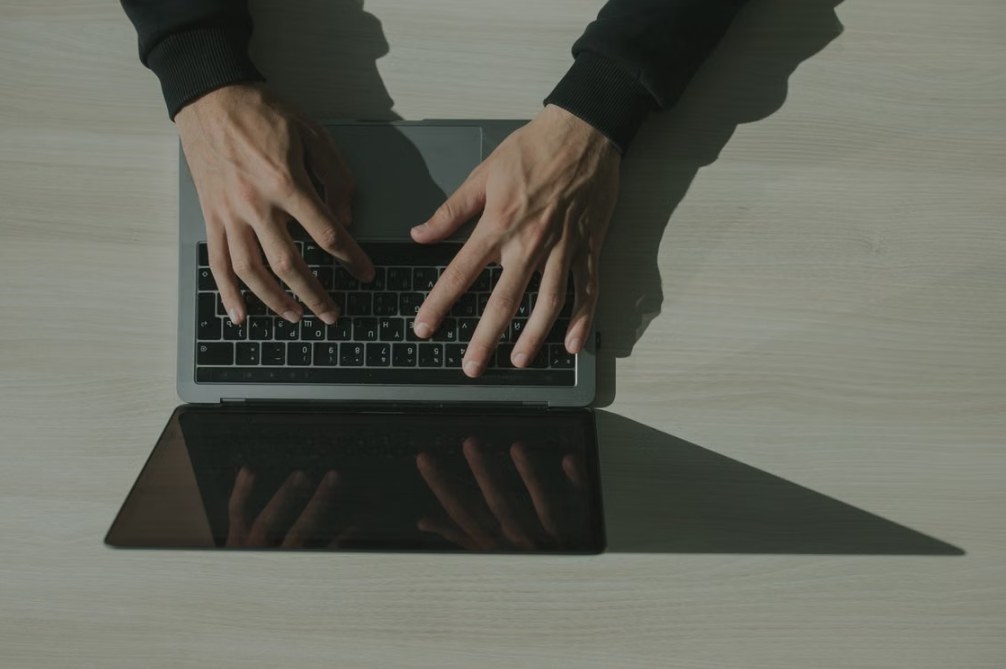 Outlook settings and email setup on a Windows laptop keyboard