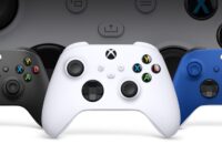 Three Xbox Wireless Controllers in black, white and blue side by side