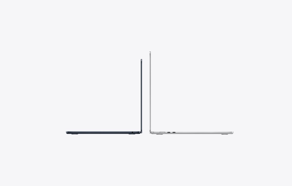 Two open MacBook Air models seen from the side showing their thin profile