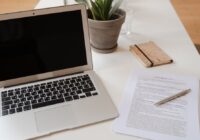 Word document black with white text - laptop and document on a desk