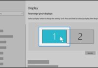 Windows 10 Display settings showing two numbered monitors to rearrange