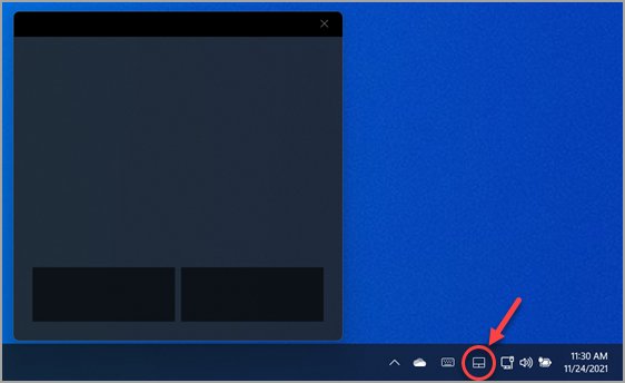 Windows 11 virtual touchpad window open above its system tray icon