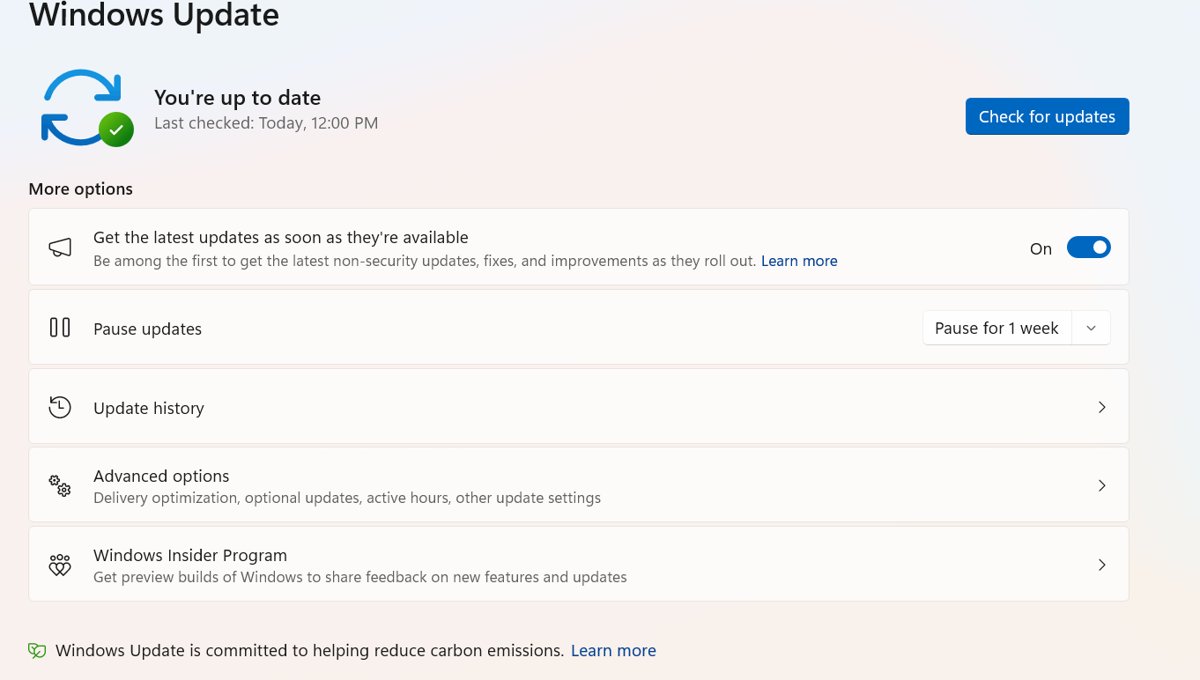 Windows Update settings page with the Pause updates drop-down and Update history