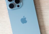 iPhone mobile data usage increases unexpectedly - smartphone on a wooden table